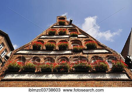 "Renaissance pediment with geraniums, Luneburg, Lower Saxony, Germany, Europe" View Large Photo Image Stock Image - "Renaissance pediment with geraniums, Luneburg, Lower Saxony, Germany, Europe". Fotosearch