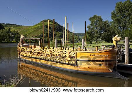 Stock Image - Replica of a Roman wine boat, Stella Noviomagi or Star of Neumagen, Neumagen-Dhron, Moselle, Rhineland-Palatinate, Germany, Europe, PublicGround, Europe. Fotosearch
