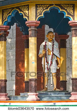 "Representation of Mahatma Gandhi with walking stick in a small pavilion on the temple wall, Meenakshi Amman Temple or Sri Meenakshi Sundareswarar Temple, Madurai, Tamil Nadu, India, Asia" View Large Photo Image Stock Image - "Representation of Mahatma Gandhi with walking stick in a small pavilion on the temple wall, Meenakshi Amman Temple or Sri Meenakshi Sundareswarar Temple, Madurai, Tamil Nadu, India, Asia". Fotosearch