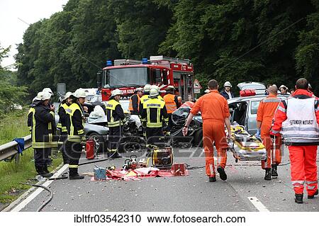 "Rescue workers from the fire brigade and the German Red Cross in action at a traffic accident on federal road 327, near Koblenz, Rhineland-Palatinate, Germany, Europe" View Large Photo Image Stock Image - "Rescue workers from the fire brigade and the German Red Cross in action at a traffic accident on federal road 327, near Koblenz, Rhineland-Palatinate, Germany, Europe". Fotosearch