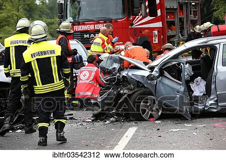 "Rescue workers from the fire brigade and the German Red Cross in action at a traffic accident on federal road 327, near Koblenz, Rhineland-Palatinate, Germany, Europe" View Large Photo Image Stock Image - "Rescue workers from the fire brigade and the German Red Cross in action at a traffic accident on federal road 327, near Koblenz, Rhineland-Palatinate, Germany, Europe". Fotosearch