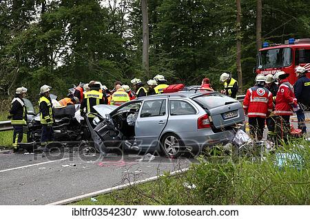 Stock Photo - "Rescue workers from the fire brigade and the German Red Cross in action at a traffic accident on federal road 327, near Koblenz, Rhineland-Palatinate, Germany, Europe". Fotosearch