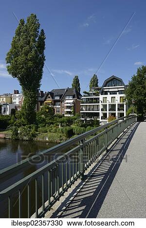"Residential houses, bridge across the Alster river, Leinpfad walkway, Alster river, Goernebruecke bridge, Hamburg, Hamburg, Germany, Europe" View Large Photo Image Stock Image - "Residential houses, bridge across the Alster river, Leinpfad walkway, Alster river, Goernebruecke bridge, Hamburg, Hamburg, Germany, Europe". Fotosearch