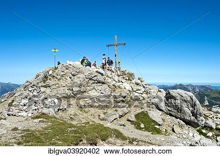 "Rest at the summit cross on the Augstenberg mountain, Ratikon, Malbun, Principality of Liechtenstein" View Large Photo Image Stock Image - "Rest at the summit cross on the Augstenberg mountain, Ratikon, Malbun, Principality of Liechtenstein". Fotosearch