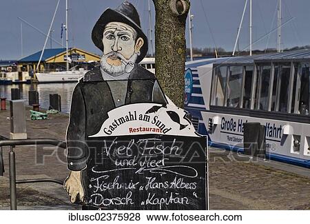 "Restaurant advertising at the harbour for dishes such as the """"Hans Albers fish mix"""", Stralsund, Mecklenburg-Western Pomerania, Germany, Europe" View Large Photo Image Stock Photo - "Restaurant advertising at the harbour for dishes such as the """"Hans Albers fish mix"""", Stralsund, Mecklenburg-Western Pomerania, Germany, Europe". Fotosearch