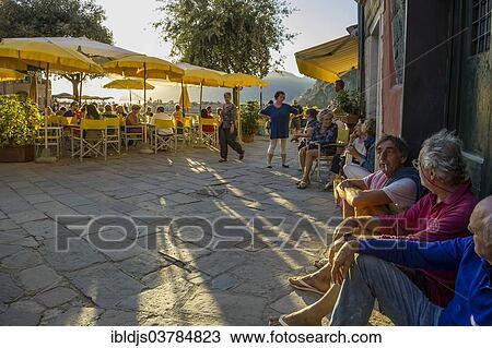 Stock Image - "Restaurant at the harbor, evening mood, Vernazza, Cinque Terre, La Spezia Province, Liguria, Italy, Europe". Fotosearch