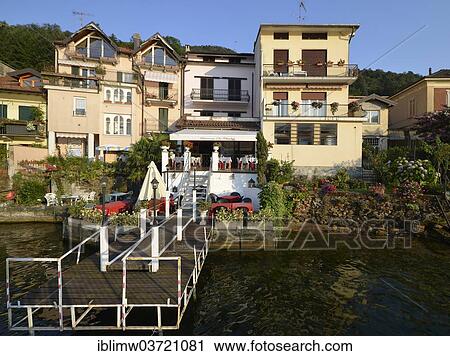 Stock Image - "Restaurant da Claudia on Lake Lugano or Lago di Lugano, Porto Ceresio, Lombardy, Italy, Europe". Fotosearch