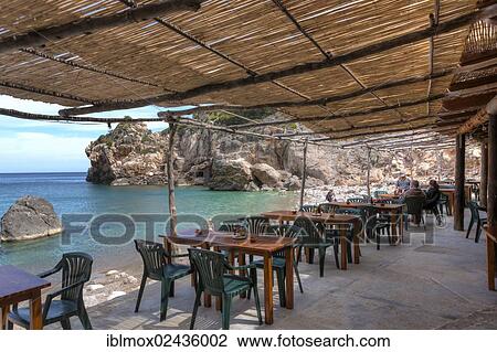 "Restaurant in a fishing village and hidden cove of Cala Deia, Deia, Serra de Tramuntana, northwest coast, Mallorca, Balearic Islands, Mediterranean Sea, Spain, Europe" View Large Photo Image Stock Image - "Restaurant in a fishing village and hidden cove of Cala Deia, Deia, Serra de Tramuntana, northwest coast, Mallorca, Balearic Islands, Mediterranean Sea, Spain, Europe". Fotosearch
