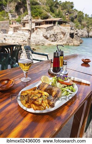 "Restaurant in a fishing village and hidden cove of Cala Deia, Deia, Serra de Tramuntana, northwest coast, Mallorca, Balearic Islands, Mediterranean Sea, Spain, Europe" View Large Photo Image Stock Photography - "Restaurant in a fishing village and hidden cove of Cala Deia, Deia, Serra de Tramuntana, northwest coast, Mallorca, Balearic Islands, Mediterranean Sea, Spain, Europe". Fotosearch