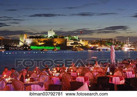 "Restaurant in Kumbahce bay with Bodrum Castle, Bodrum, Mugla Province, Aegean Region, Turkey, Asia" View Large Photo Image Stock Image - "Restaurant in Kumbahce bay with Bodrum Castle, Bodrum, Mugla Province, Aegean Region, Turkey, Asia". Fotosearch