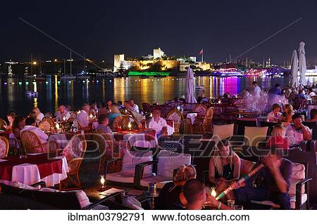 "Restaurant in Kumbahce bay with Bodrum Castle, Bodrum, Mugla Province, Aegean Region, Turkey, Asia" View Large Photo Image Stock Image - "Restaurant in Kumbahce bay with Bodrum Castle, Bodrum, Mugla Province, Aegean Region, Turkey, Asia". Fotosearch