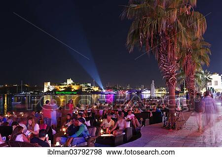 "Restaurant in Kumbahce bay with Bodrum Castle, Bodrum, Mugla Province, Aegean Region, Turkey, Asia" View Large Photo Image Stock Photo - "Restaurant in Kumbahce bay with Bodrum Castle, Bodrum, Mugla Province, Aegean Region, Turkey, Asia". Fotosearch