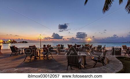 Stock Photo - "Restaurant of Paradise Island at dusk, Indian Ocean, Male, North Male Atoll, Maldives, Asia". Fotosearch