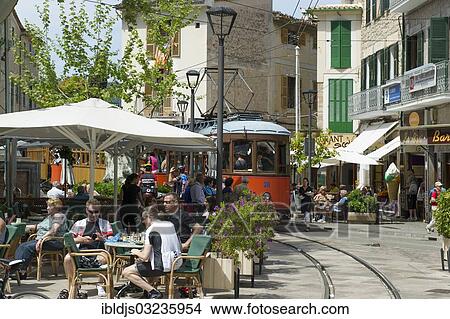 "Restaurants and a tram, Soller, Majorca, Balearic Islands, Spain, Europe" View Large Photo Image Picture - "Restaurants and a tram, Soller, Majorca, Balearic Islands, Spain, Europe". Fotosearch