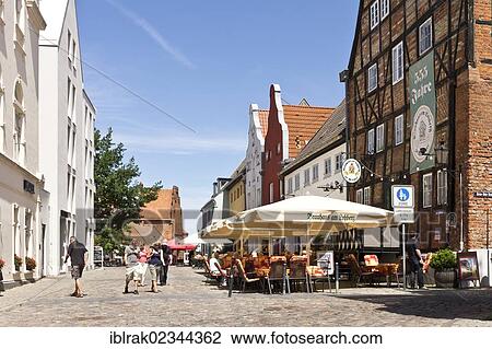 Stock Image - "Restaurants and office buildings near the old port, Wismar, Mecklenburg-Western Pomerania, Germany, Europe". Fotosearch
