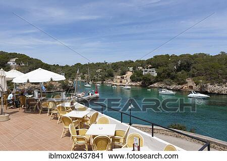 Stock Image - "Restaurants in the bay, harbour of Cala Figuera, Santanyi Region, Mallorca, Majorca, Balearic Islands, Mediterranean Sea, Spain, Europe". Fotosearch