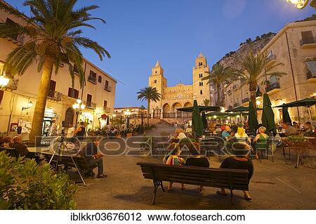 "Restaurants on Piazza Duomo square in the evening, Cathedral-Basilica of the Holy Saviour, Basilica Cattedrale del Santissimo Salvatore at the rear, Cefalu, Province of Palermo, Sicily, Italy, Europe" View Large Photo Image Stock Image - "Restaurants on Piazza Duomo square in the evening, Cathedral-Basilica of the Holy Saviour, Basilica Cattedrale del Santissimo Salvatore at the rear, Cefalu, Province of Palermo, Sicily, Italy, Europe". Fotosearch
