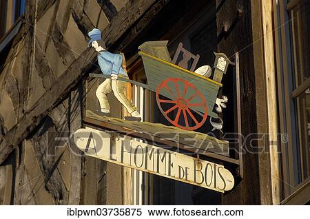 Stock Photography - "Restaurants sign, """"A L'homme de Bois"""", Honfleur, Normandy, France, Europe". Fotosearch
