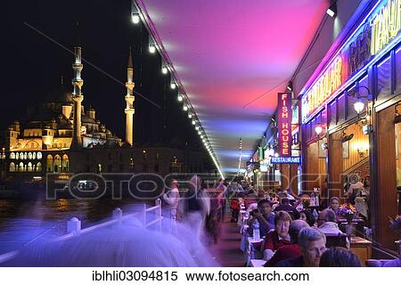 Stock Photography - "Restaurants under the Galata Bridge, Golden Horn, New Mosque, Yeni Cami, Istanbul, Istanbul Province, Turkey, Asia". Fotosearch