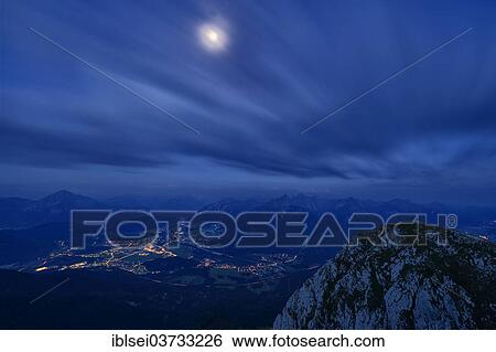 "Reutte at dusk with dramatic clouds and a full moon, Reutte, Reutte District, Tyrol, Austria, Europe" View Large Photo Image Stock Photograph - "Reutte at dusk with dramatic clouds and a full moon, Reutte, Reutte District, Tyrol, Austria, Europe". Fotosearch