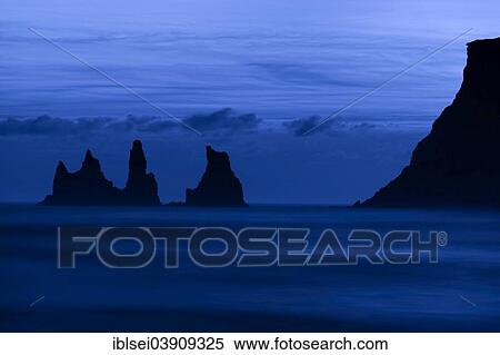 "Reynisdrangar rocks in the sea, dusk, blue hour, Vik, Southern Region, Iceland, Europe" View Large Photo Image Stock Photography - "Reynisdrangar rocks in the sea, dusk, blue hour, Vik, Southern Region, Iceland, Europe". Fotosearch