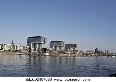 "Rheinau Harbour with the Rhine River, the Crane Buildings of Cologne and Cologne Cathedral, Cologne, North Rhine-Westphalia, Germany, Europe" View Large Photo Image Stock Photograph - "Rheinau Harbour with the Rhine River, the Crane Buildings of Cologne and Cologne Cathedral, Cologne, North Rhine-Westphalia, Germany, Europe". Fotosearch
