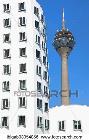 Stock Photograph - "Rheinturm, Medienhafen or Media Harbour, Dusseldorf, Rhineland, North Rhine-Westphalia, Germany, Europe". Fotosearch