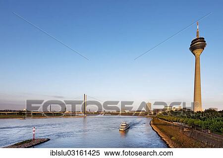 Stock Photography - "Rheinturm, Rhine Tower, Rheinkniebruecke bridge, old town, Dusseldorf, Rhineland, North Rhine-Westphalia, Germany, Europe". Fotosearch