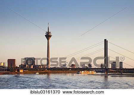 Stock Image - "Rhine, Rheinturm, Rhine Tower, television tower, Medienhafen, media harbour, Dusseldorf, Rhineland, North Rhine-Westphalia, Germany, Europe". Fotosearch
