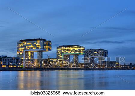 "Rhine River and Rheinauhafen with the Crane Houses at the blue hour, Cologne, North Rhine-Westphalia, Germany, Europe" View Large Photo Image Stock Photograph - "Rhine River and Rheinauhafen with the Crane Houses at the blue hour, Cologne, North Rhine-Westphalia, Germany, Europe". Fotosearch