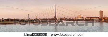 "Rhine River and Rheinkniebrucke bridge, Dusseldorf, North Rhine-Westphalia, Germany, Europe" View Large Photo Image Stock Image - "Rhine River and Rheinkniebrucke bridge, Dusseldorf, North Rhine-Westphalia, Germany, Europe". Fotosearch