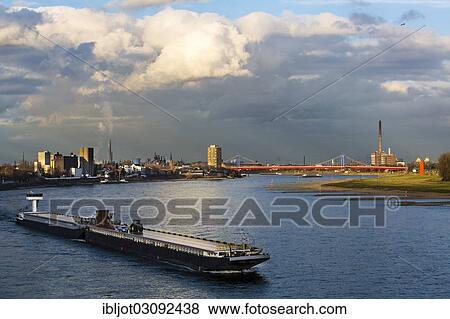 "Rhine River, Homberger Rheinbruecke bridge, power plant, estuary of the Ruhr River with the artwork Rheinorange, Rhine ship travelling against the current, Homberg, Duisburg, North Rhine-Westphalia, Germany, Europe" View Large Photo Image Stock Photo - "Rhine River, Homberger Rheinbruecke bridge, power plant, estuary of the Ruhr River with the artwork Rheinorange, Rhine ship travelling against the current, Homberg, Duisburg, North Rhine-Westphalia, Germany, Europe". Fotosearch