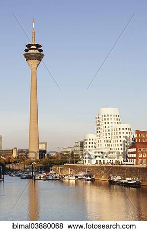 Stock Photo - "Rhine Tower and the Gehry Buildings at Media Harbour, Dusseldorf, North Rhine-Westphalia, Germany, Europe". Fotosearch