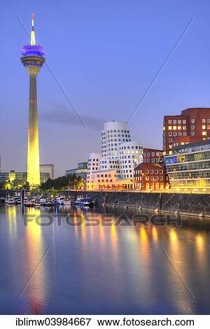 Stock Photo - "Rhine tower, Gehry Buildings, Neuer Zollhof, media harbor, dusk, blue hour, Dusseldorf, North Rhine-Westphalia, Germany, Europe". Fotosearch