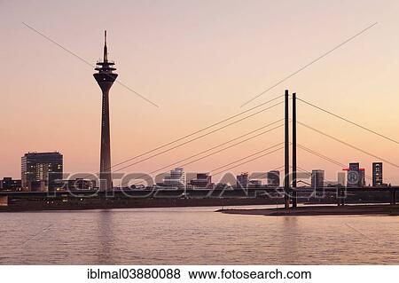 Stock Photo - "Rhine Tower, Rheinkniebrucke bridge and Gehry Buildings, Dusseldorf, North Rhine-Westphalia, Germany, Europe". Fotosearch