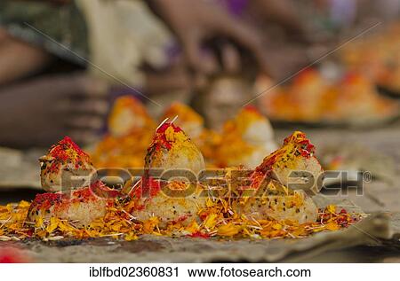 "Rice balls and flowers as part of the ritual to pray farewell for the soul of a deceased person, at the ghats of Varanasi, India, Asia" View Large Photo Image Stock Image - "Rice balls and flowers as part of the ritual to pray farewell for the soul of a deceased person, at the ghats of Varanasi, India, Asia". Fotosearch