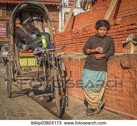 "Rickshaw driver and a woman taking a rest, Kathmandu, Bagmati Zone, Nepal, Asia" View Large Photo Image Stock Image - "Rickshaw driver and a woman taking a rest, Kathmandu, Bagmati Zone, Nepal, Asia". Fotosearch