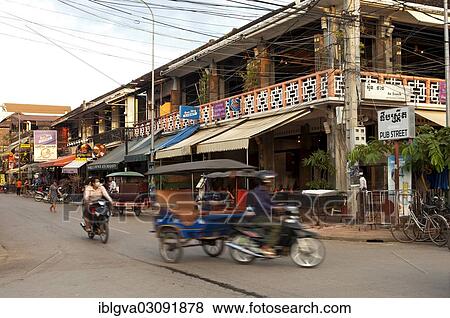 "Rickshaw in traffic in front of restaurants and bars in Pub Street, Siem Reap, Siem Reap Province, Cambodia, Asia" View Large Photo Image Stock Photo - "Rickshaw in traffic in front of restaurants and bars in Pub Street, Siem Reap, Siem Reap Province, Cambodia, Asia". Fotosearch
