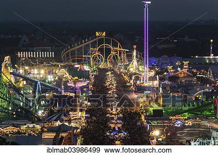 "Rides on the fairground road with Olympia Looping, Funferlooping roller coaster at night, Oktoberfest, Theresienwiese, Munich, Upper Bavaria, Bavaria, Germany, Europe" View Large Photo Image Stock Photo - "Rides on the fairground road with Olympia Looping, Funferlooping roller coaster at night, Oktoberfest, Theresienwiese, Munich, Upper Bavaria, Bavaria, Germany, Europe". Fotosearch