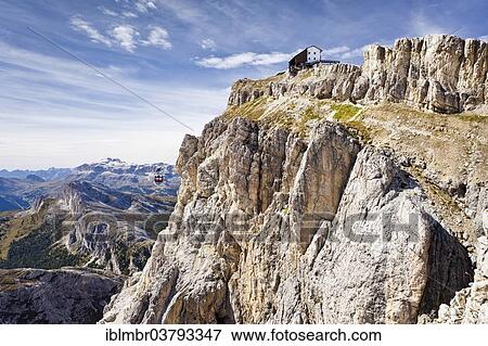 "Rifugio Lagazuoi mountain hut with a cable car, overlooking the Puez Group and Sellastock Mountain, Dolomites, Belluno, Italy, Europe" View Large Photo Image Stock Photo - "Rifugio Lagazuoi mountain hut with a cable car, overlooking the Puez Group and Sellastock Mountain, Dolomites, Belluno, Italy, Europe". Fotosearch