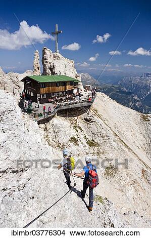 "Rifugio Lorenzi mountain hut, mountain climbers descending along the Via Ferrata Marino Bianchi climbing route from Cristallo di Mezzo Mountain, Dolomites, Belluno, Italy, Europe" View Large Photo Image Picture - "Rifugio Lorenzi mountain hut, mountain climbers descending along the Via Ferrata Marino Bianchi climbing route from Cristallo di Mezzo Mountain, Dolomites, Belluno, Italy, Europe". Fotosearch