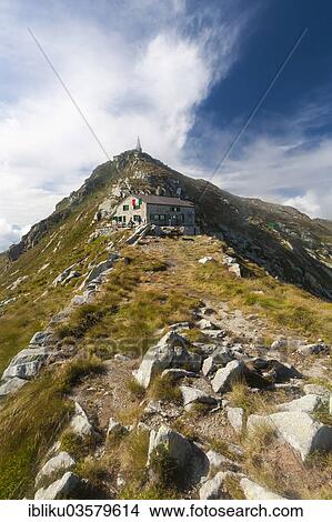 Picture - "Rifugio Mombarone, with the summit of Mt Mombarone or Colma di Mombarone at back, Mombarone, near Graglia, Biella province, Piedmont, Italy, Europe". Fotosearch