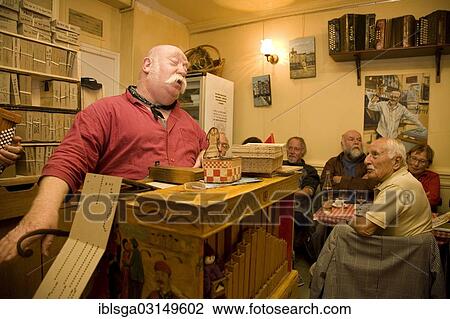 Stock Image - "Riton La Manivelle, chanson singer, restaurant Le Vieux Belleville, Belleville, Paris, Ile-de-France, France, Europe". Fotosearch
