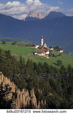 "Rittner Earth Pyramids, Mt Sasso Lungo or Langkofel and Mt Sasso Piatto or Plattkofel at back, Lengmoos, South Tyrol province, Trentino-Alto Adige, Italy, Europe" View Large Photo Image Stock Photography - "Rittner Earth Pyramids, Mt Sasso Lungo or Langkofel and Mt Sasso Piatto or Plattkofel at back, Lengmoos, South Tyrol province, Trentino-Alto Adige, Italy, Europe". Fotosearch