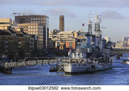 Stock Image - "River Thames, HMS Belfast museum ship seen from Tower Bridge, City of London, London, London region, England, United Kingdom, Europe". Fotosearch