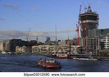 "River Thames with tourist boats, Billingsgate Market, Custom House, The Monument and office building construction site of 20 Fenchurch Street, seen from Tower Bridge, City of London, London, London region, England, United Kingdom, Europe" View Large Photo Image Stock Image - "River Thames with tourist boats, Billingsgate Market, Custom House, The Monument and office building construction site of 20 Fenchurch Street, seen from Tower Bridge, City of London, London, London region, England, United Kingdom, Europe". Fotosearch
