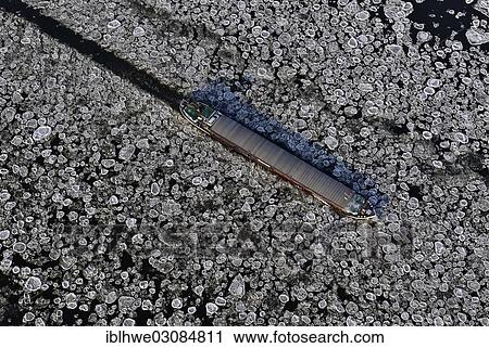 "Riverboat used for bulk cargo transport from the Imperial Reederei in icy conditions, ice floes on the Elbe River, Geesthacht, Schleswig-Holstein, Germany, Europe" View Large Photo Image Stock Image - "Riverboat used for bulk cargo transport from the Imperial Reederei in icy conditions, ice floes on the Elbe River, Geesthacht, Schleswig-Holstein, Germany, Europe". Fotosearch