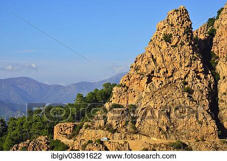 "Road along the typical sandstone cliffs, Calanques de Piana, Corsica, France, Europe" View Large Photo Image Stock Image - "Road along the typical sandstone cliffs, Calanques de Piana, Corsica, France, Europe". Fotosearch