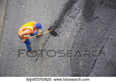 "Road construction worker, tarmac laying works at a road construction site, Essen, North Rhine-Westphalia, Germany, Europe" View Large Photo Image Stock Photography - "Road construction worker, tarmac laying works at a road construction site, Essen, North Rhine-Westphalia, Germany, Europe". Fotosearch