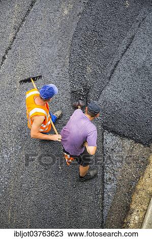 "Road construction workers, tarmac laying works at a road construction site, Essen, North Rhine-Westphalia, Germany, Europe" View Large Photo Image Stock Image - "Road construction workers, tarmac laying works at a road construction site, Essen, North Rhine-Westphalia, Germany, Europe". Fotosearch